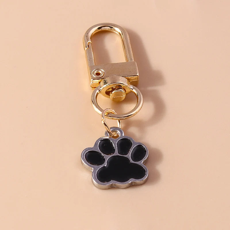 Porte-clés mignon de patte d'animal familier de chiot
