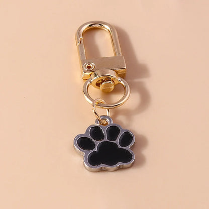 Porte-clés mignon de patte d'animal familier de chiot