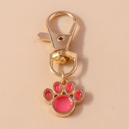 Porte-clés mignon de patte d'animal familier de chiot