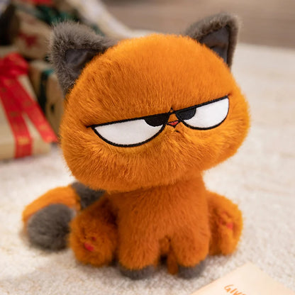 かわいいオレンジ色の猫のぬいぐるみ