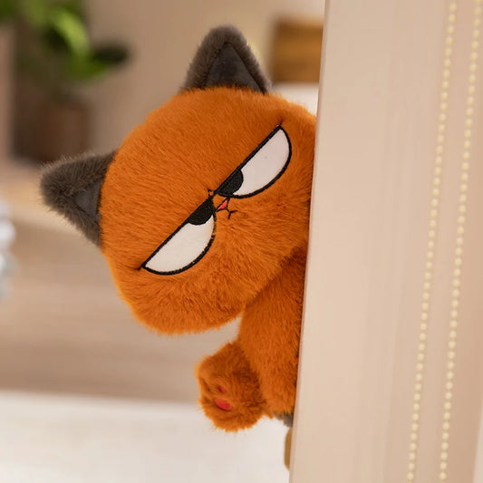 かわいいオレンジ色の猫のぬいぐるみ
