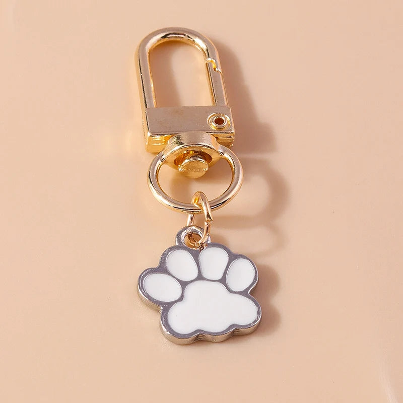 Porte-clés mignon de patte d'animal familier de chiot
