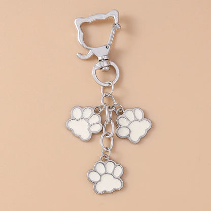 Porte-clés mignon de patte d'animal familier de chiot